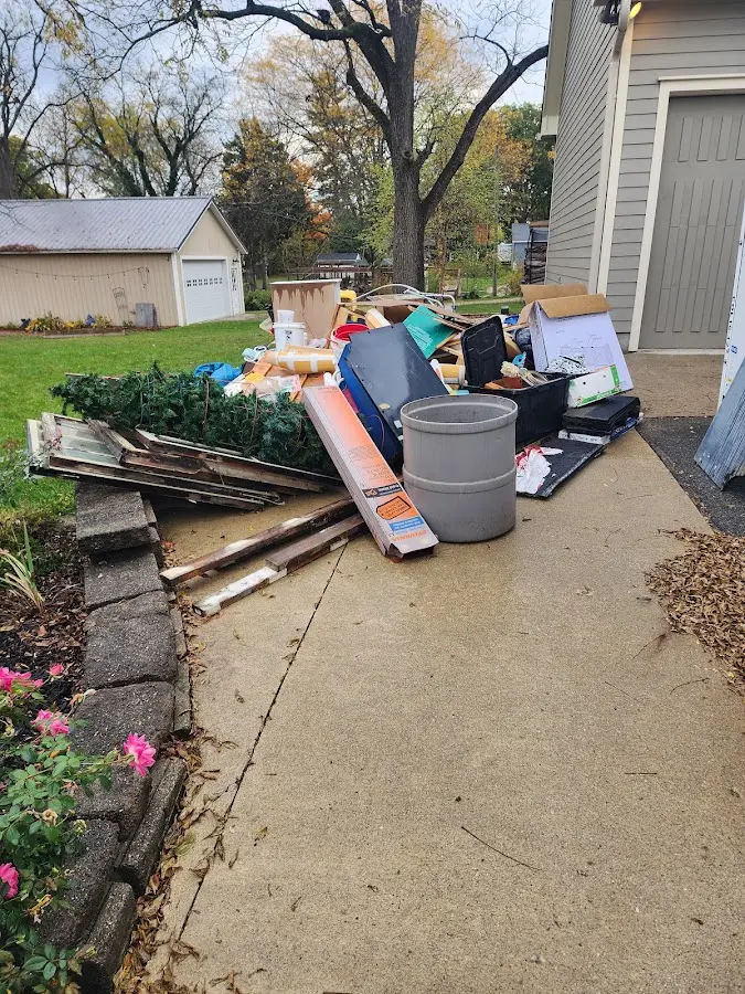 Dumpster being loaded with debris for Commercial Dumpster Rental in Vinton